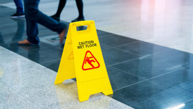 Wet floor sign in building to prevent injury and public liability claims.
