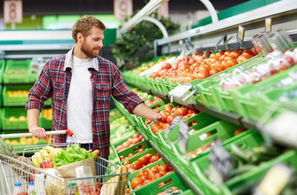 Man grocery shopping for fruit and vegetables