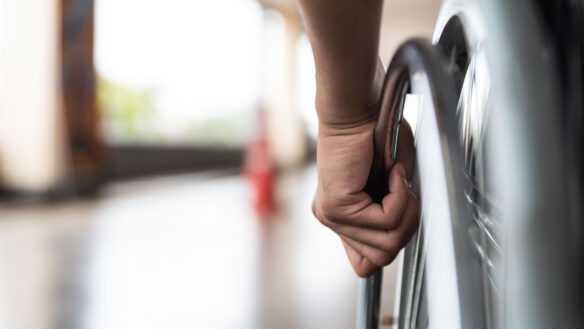 Wheelchair bound person getting around after a TPD payout.