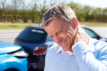 Man with a neck injury after a car accident and potentially eligible for CTP compensation.