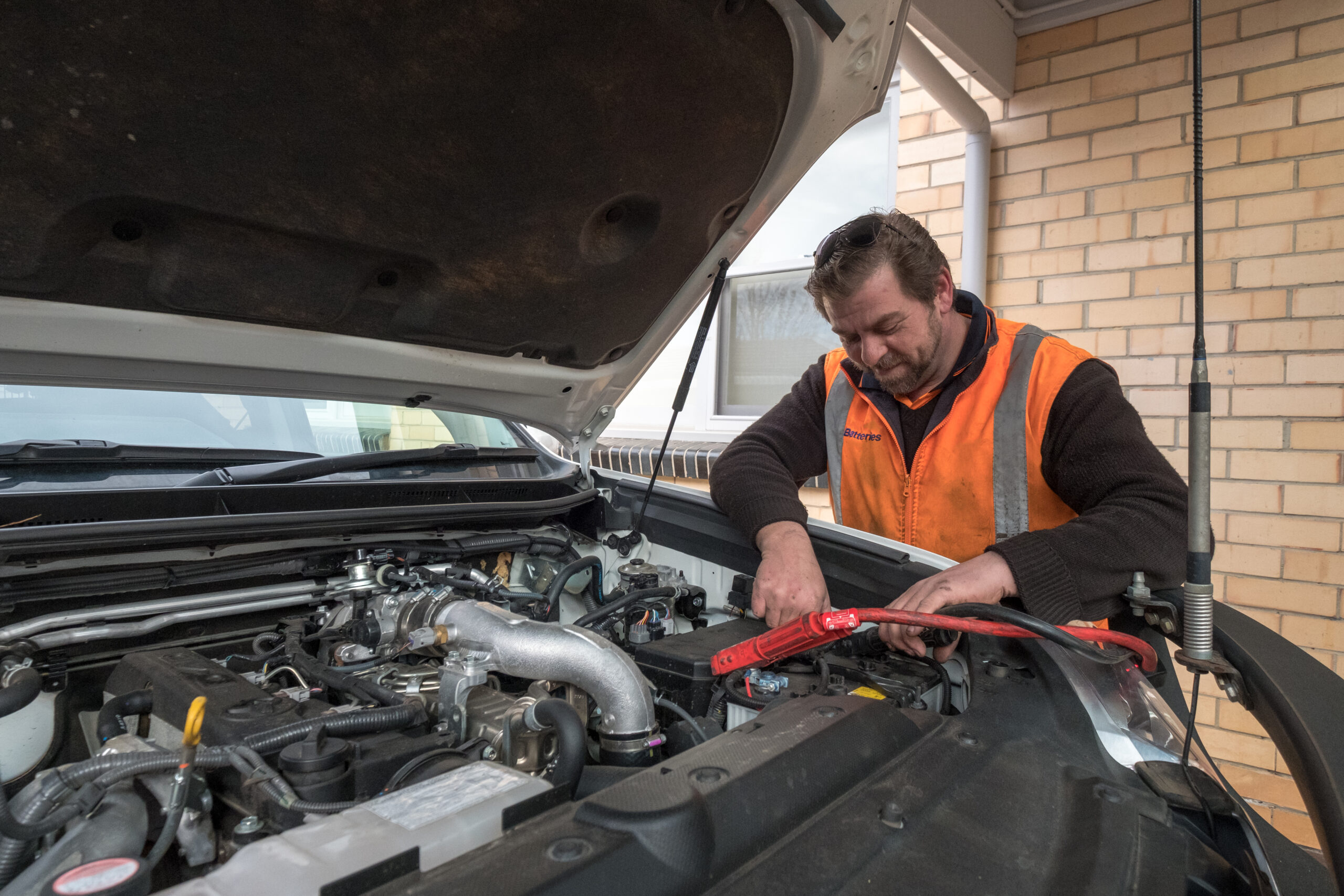 Mechanic Working on Car Engine - Injured in Work Accident