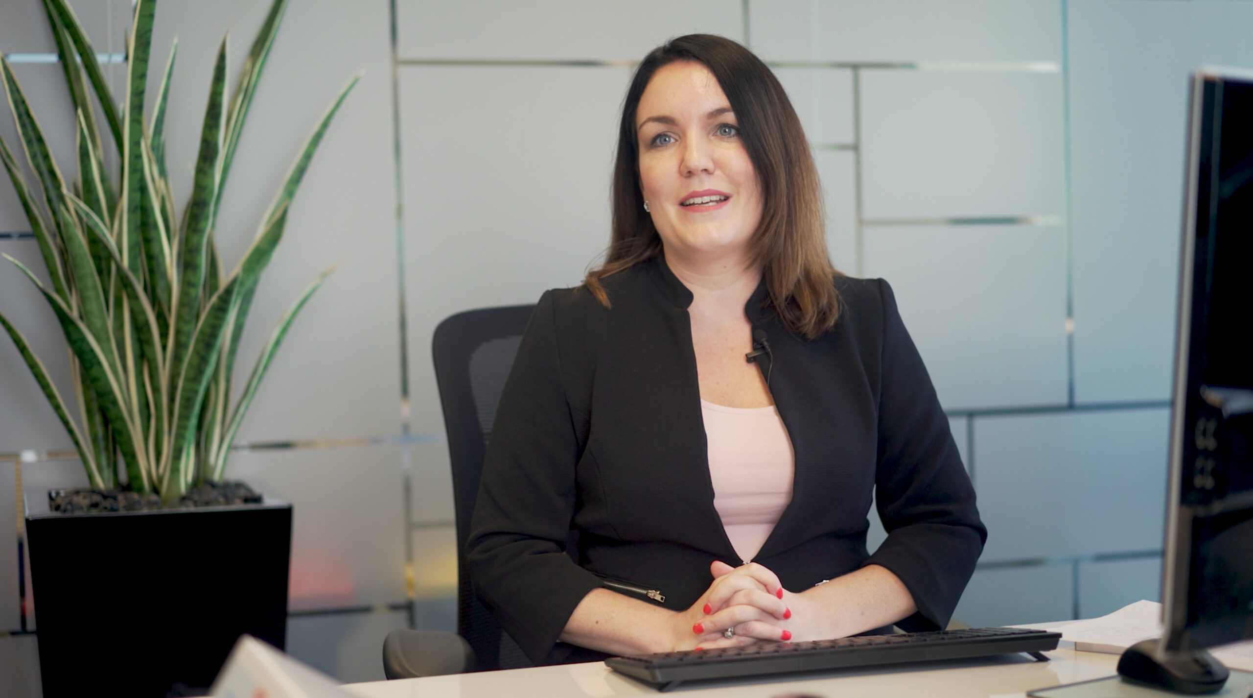 solicitor smiling at desk