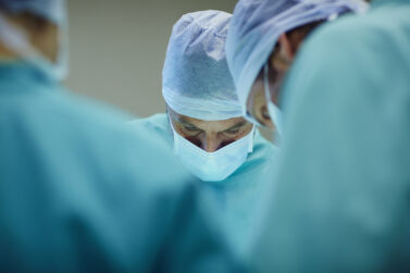 Surgeons performing a risky operation that could lead to a medical negligence claim
